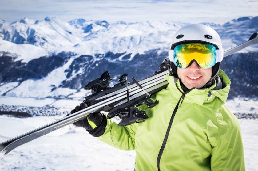 Young successful men ski mountain winter resort